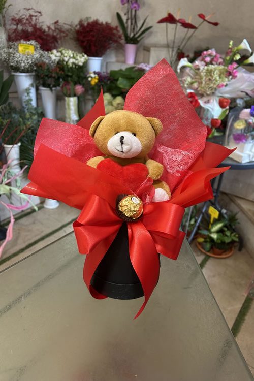 Teddy bear in a box with Ferrero Rocher